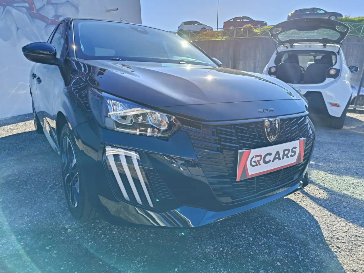 Peugeot E-208 2024 GR Cars Stand Automóvel